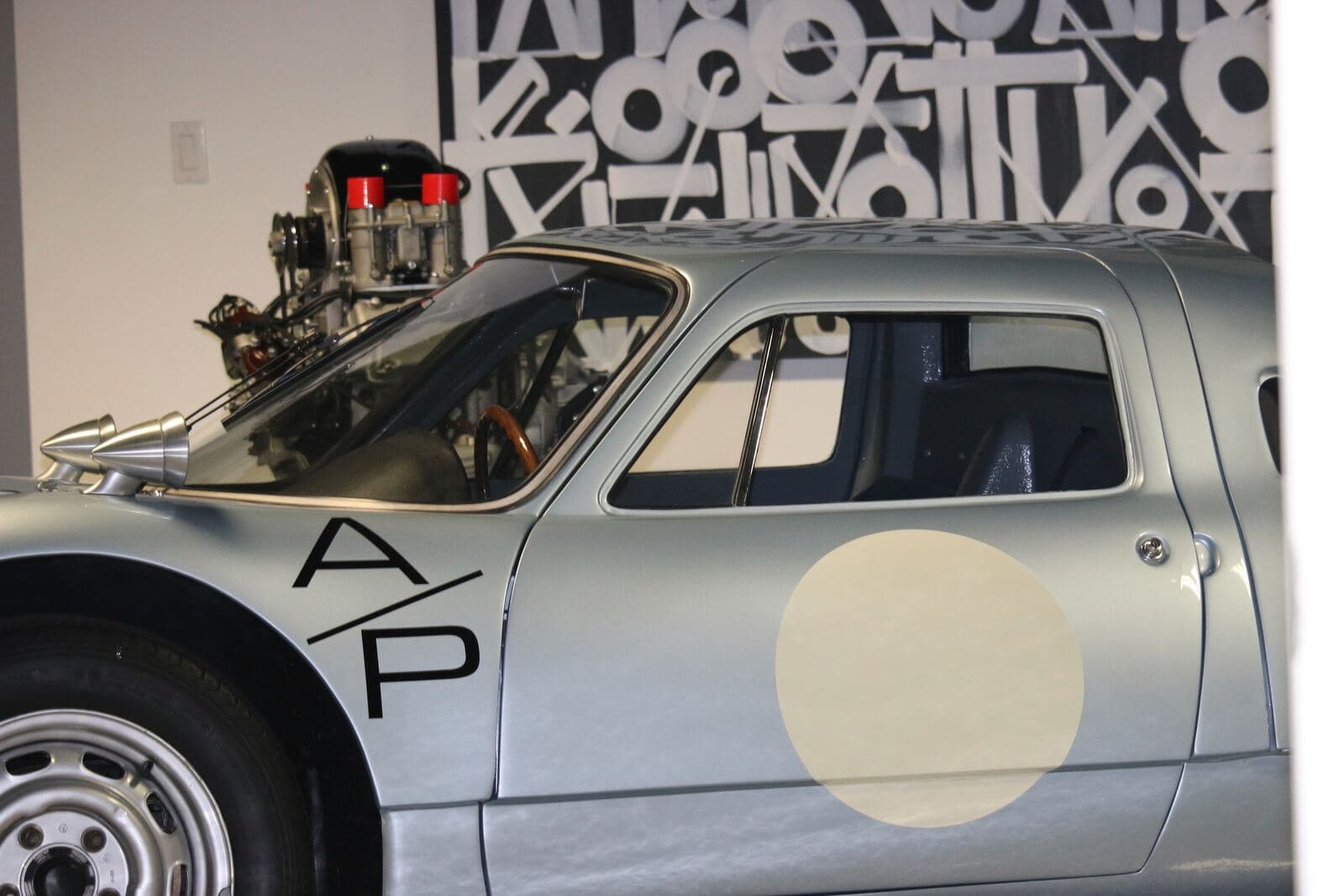 Porsche 904 with its engine exposed, mid-service