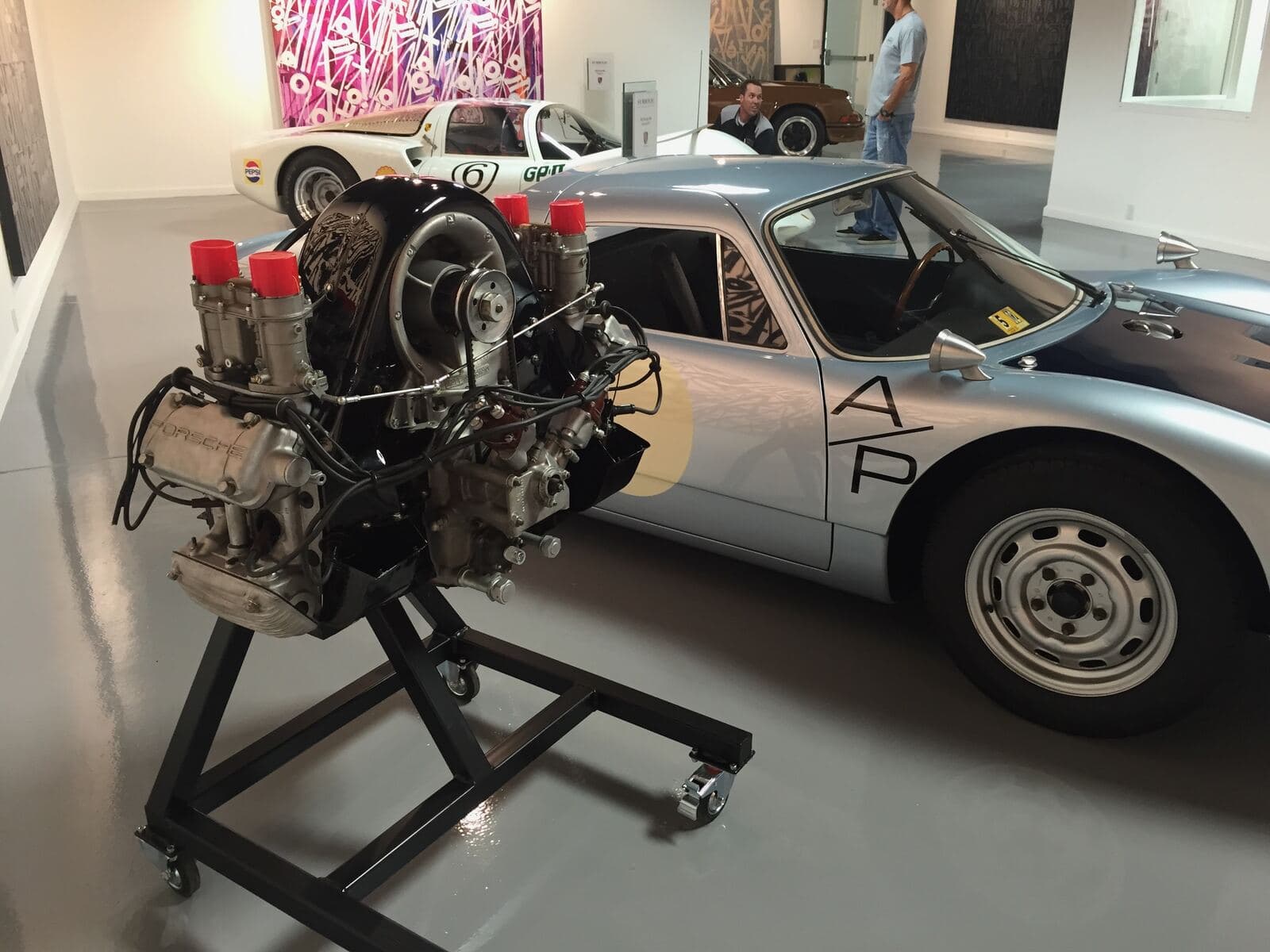 Porsche 904 in a workshop with its race engine on a stand